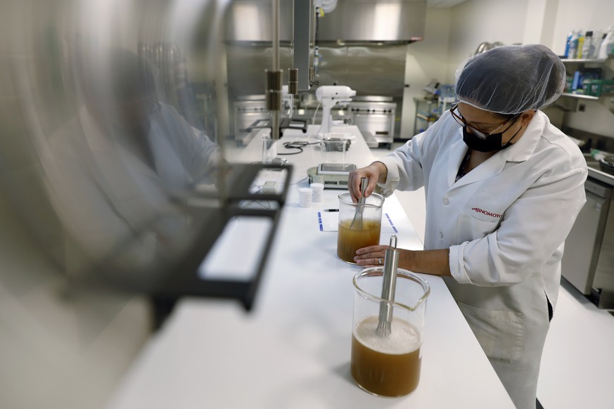 Cathy Legatos, associate director of application development of Ajinomoto, a global food and pharmaceutical company, works at the office sensory lab in Itasca, Ill., Monday, June 7, 2021. In May, Ajin ...