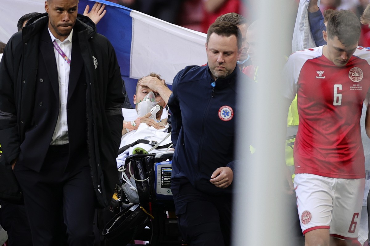 Paramedics using a stretcher to take out of the pitch Denmark's Christian Eriksen after he collapsed during the Euro 2020 soccer championship group B match between Denmark and Finland at Parken s ...
