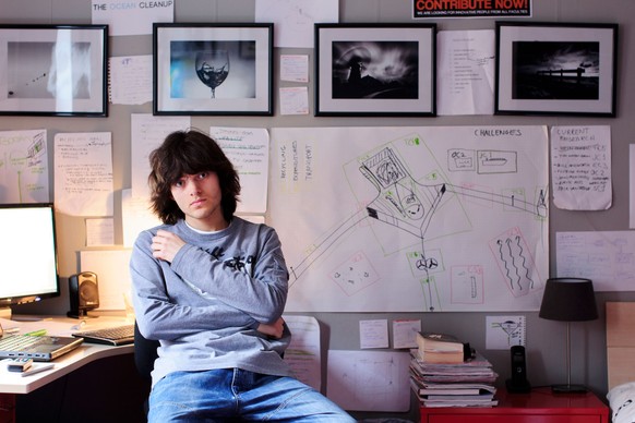 In this March 3rd, 2013, photo provided by The Ocean Cleanup shows its CEO and Founder Boyan Slat, a Dutch entepreneur and inventor working from his bedroom before The Ocean Cleanup had an office in D ...