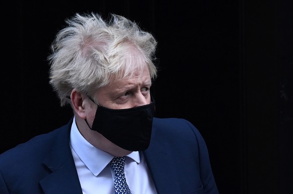 epa09680251 British Prime Minister Boris Johnson departs 10 Downing Street for the PMQs in London, Britain, 12 January 2022. Johnson is set to face MPs during Prime Minister&#039;s Questions (PMQs) at ...