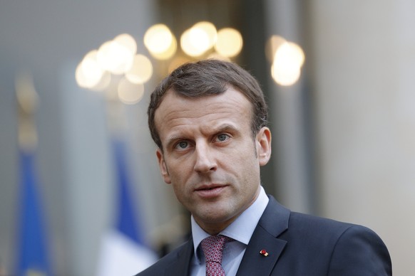 epaselect epa06367038 French President Emmanuel Macron speaks to the media following his meeting with Bulgarian President Rumen Radev (not pictured) at the Elysee Palace in Paris, France, 04 December  ...