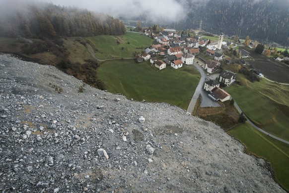 epa11716315 A general view shows a discharge of rocks and debris near the village of Brienz, Brienz-Brinzauls, Switzerland, 12 November 2024. On 15 June 2024, a stream of debris almost reached the vil ...