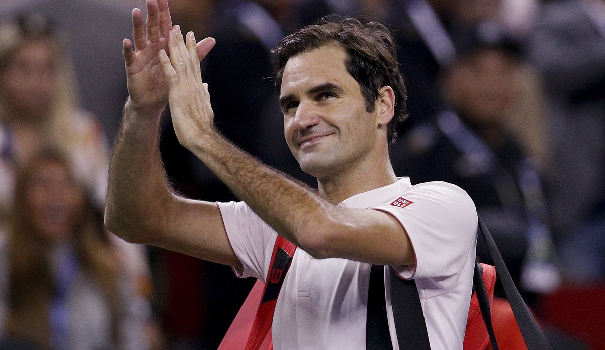 Roger Federer of Switzerland gestures to the spectators after losing his men's singles semifinals match to Borna Coric of Croatia in the Shanghai Masters tennis tournament at Qizhong Forest Sport ...
