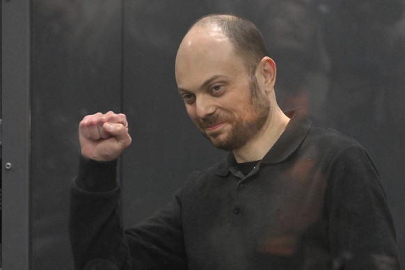 FILE - Russian opposition activist Vladimir Kara-Murza gestures while standing in a glass cage in a courtroom during the announcement of the verdict on appeal at the Moscow City Court on July 31, 2023 ...