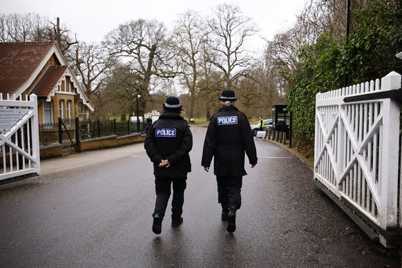 epa12764527 Police officers patrol the area around Royal Lodge past the media where Andrew Mountbatten-Windsor (formerly Prince Andrew, the Duke of York) used to live continues to be searched by Thame ...