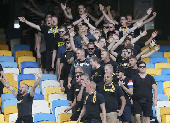 Young Boys fans show support to their team during the Champions League third qualifying round, 1st leg soccer match between Dynamo Kiev and Young Boys at the Olympiyskiy Stadium in Kiev, Ukraine, Wedn ...