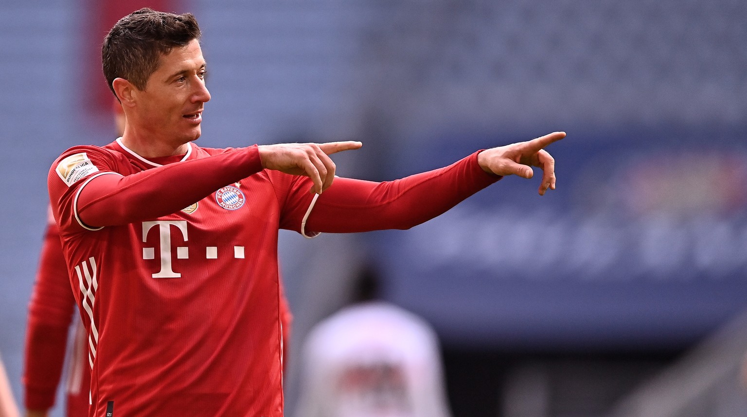 epa09086022 Bayern&#039;s Robert Lewandowski celebrates after scoring the 3-0 lead during the German Bundesliga soccer match between FC Bayern Muenchen and VfB Stuttgart in Munich, Germany, 20 March 2 ...