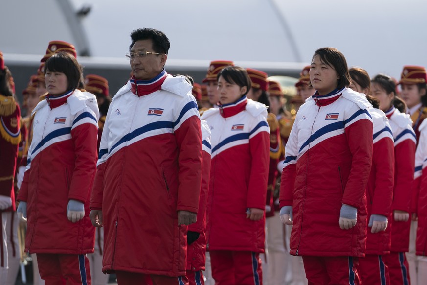 North Korea&#039;s vice sports minister Won Gil-woo, second left, stands next to members of the North Korea Olympic Team during a welcome ceremony inside the Gangneung Olympic Village prior to the 201 ...