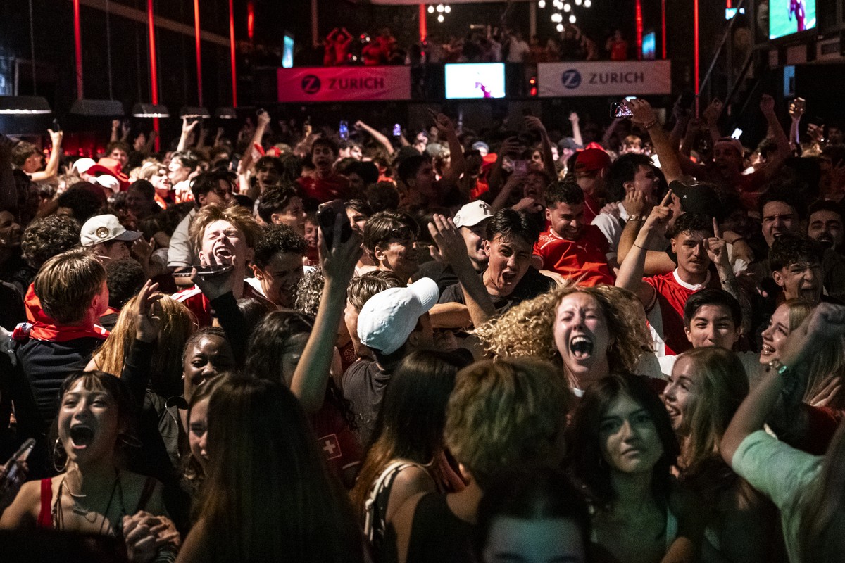 Swiss fans cheer as they watch the 2026 FIFA World Cup soccer round of 16 soccer match between Switzerland and Colombia at the public viewing in the Maag Music Hall in Zurich, Switzerland on Tuesday,  ...