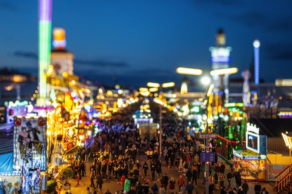 epa10190448 A picture taken with a tilt-shift lens shows a general view on beer tents and crowds during the 187th edition of the traditional Oktoberfest beer and amusement festival in the German Bavar ...