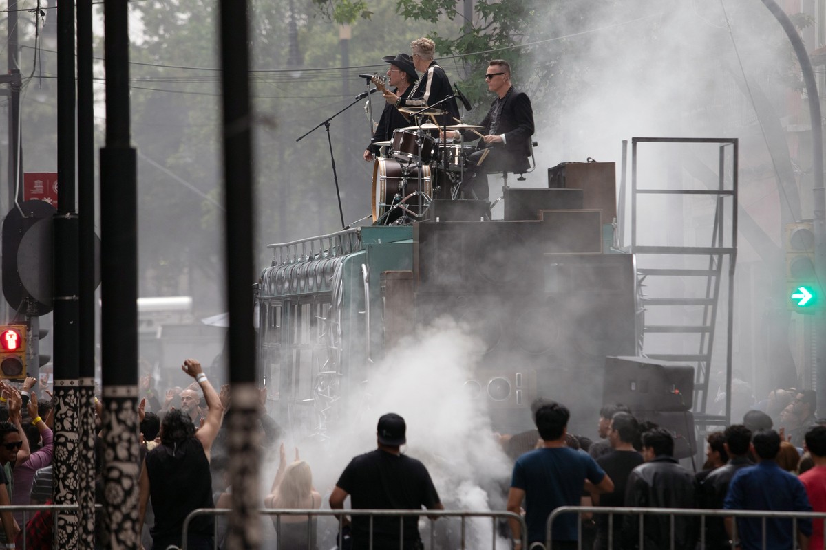 epa12952107 (L-R) U2 members Bono, Adam Clayton, and Larry Mullen Jr. film the music video for the song 'Street of Dreams' in Mexico City?s Historic Center in Mexico City, Mexico, 12 May 202 ...