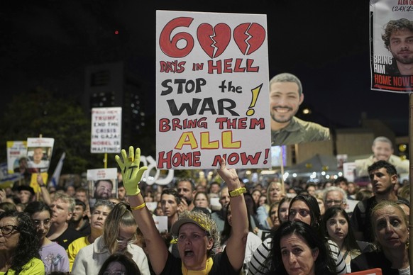 People attend a rally marking 600 days since Israelis were taken hostage by Hamas in Gaza, demanding their release and an end to the war, at a plaza known as the hostages square in Tel Aviv, Israel, W ...