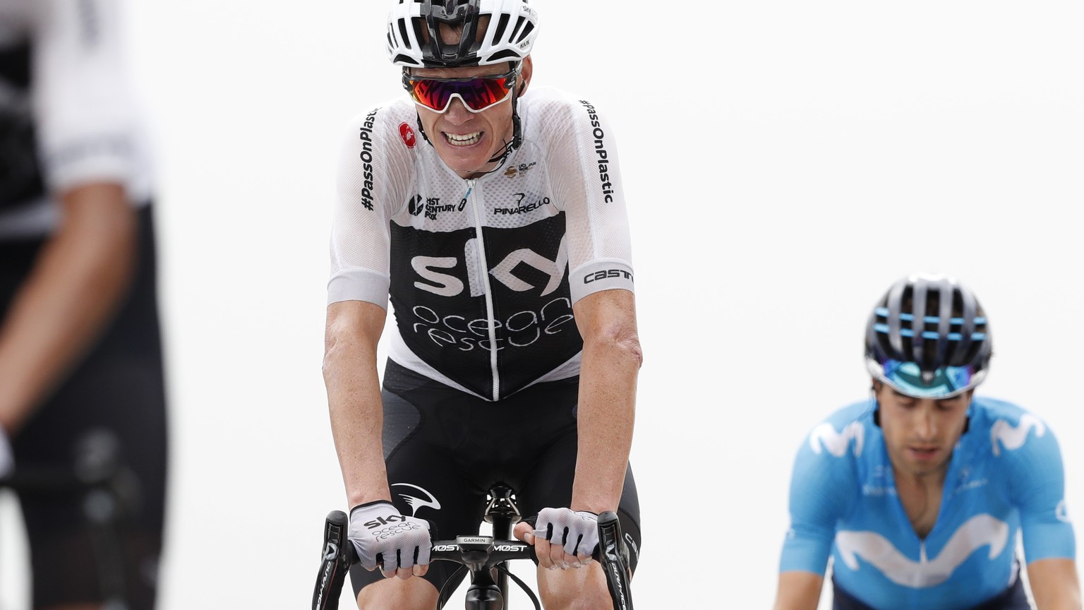 Britain&#039;s Chris Froome, center, crosses the finish line ahead of Spain&#039;s Mikel Landa Meana, right, during the seventeenth stage of the Tour de France cycling race over 65 kilometers (40.4 mi ...