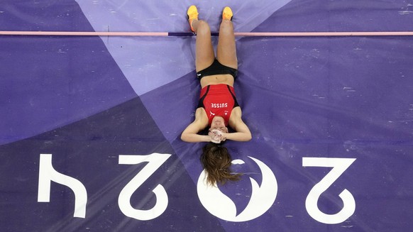 Angelica Moser, of Switzerland, reacts after missing her final attempt in the women's pole vault final at the 2024 Summer Olympics, Wednesday, Aug. 7, 2024, in Saint-Denis, France. (AP Photo/Davi ...