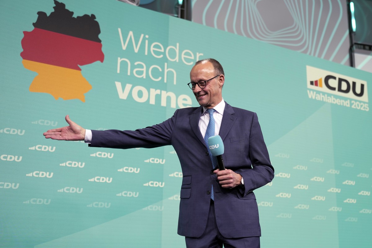 Friedrich Merz, the candidate of the mainstream conservative Christian Democratic Union party, gestures while addressing supporters at the party headquarters in Berlin, Germany, Sunday, Feb. 23, 2025, ...