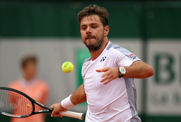 epa07610553 Stan Wawrinka of Switzerland reacts after winning against Cristian Garin of Chile their menâs second round match during the French Open tennis tournament at Roland Garros in Paris, Franc ...