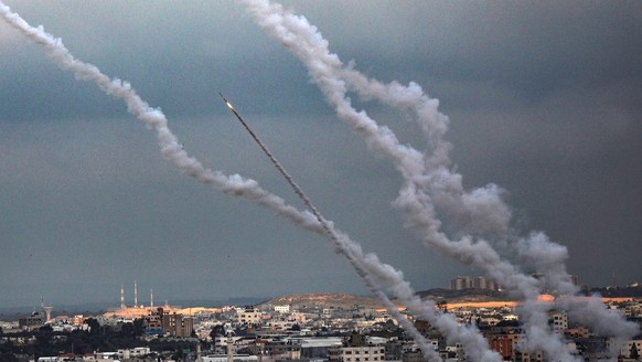 epaselect epa08244428 Rockets fired from Gaza fly towards Israel, in Gaza City, 24 February 2020. According to media reports, Islamic Jihad fired several rockets and mortars from Gaza towards Israel o ...