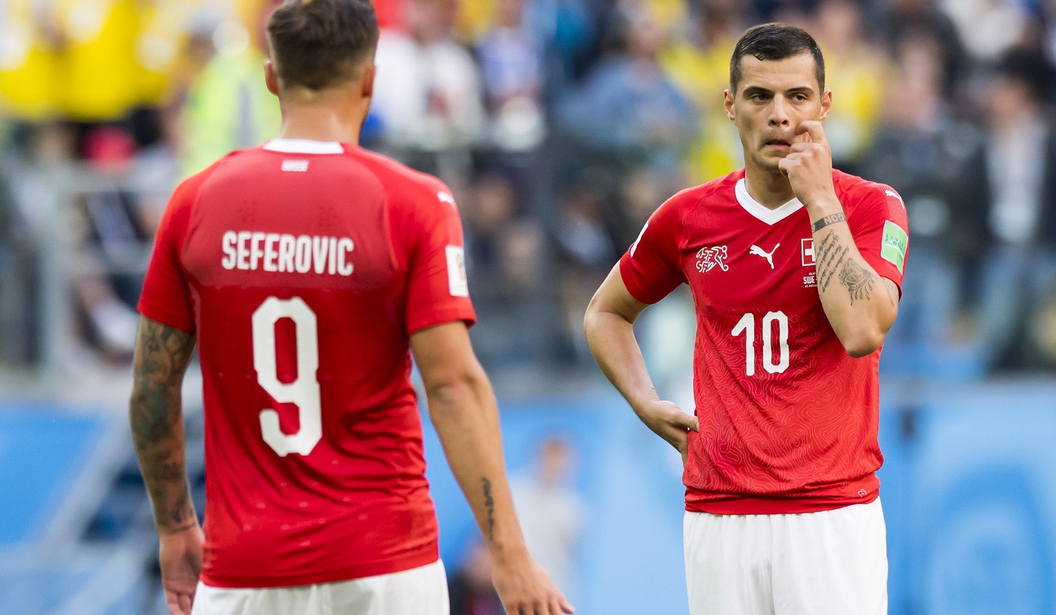 epa06861333 Switzerland&#039;s forward Haris Seferovic (L) and Switzerland&#039;s midfielder Granit Xhaka react during the FIFA World Cup 2018 round of 16 soccer match between Sweden and Switzerland i ...