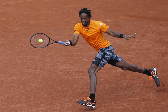 France&#039;s Gael Monfils plays a shot against Switzerland&#039;s Stan Wawrinka during their fourth round match of the French Open tennis tournament at the Roland Garros stadium, in Paris, France. Mo ...
