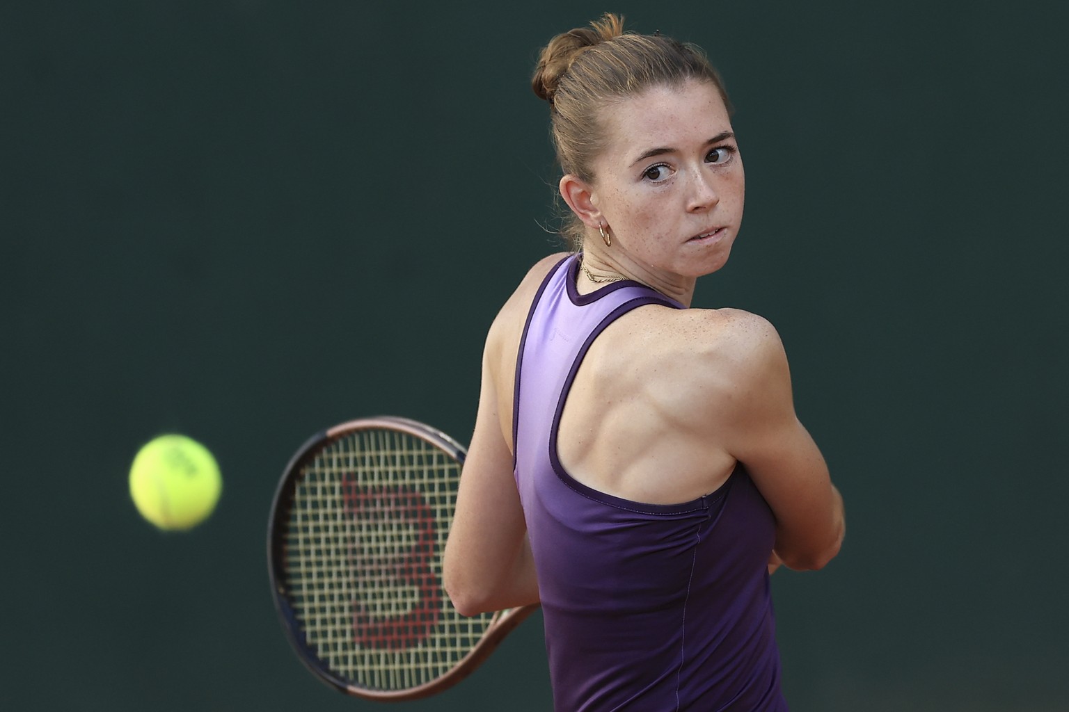 Switzerland&#039;s Simona Waltert plays a shot against Elizabeth Mandlik of the U.S. during their first round match of the French Open tennis tournament at the Roland Garros stadium in Paris, Monday,  ...