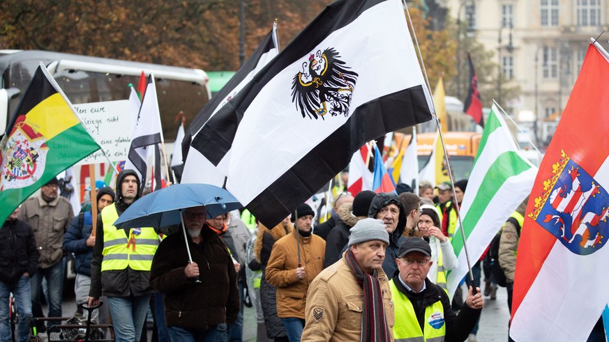 epa07983488 A march of the far-right group &#039;Reichsbuerger&#039; (lit. Citizens of the Reich) in Berlin, Germany, 09 November 2019. Demonstrators from several anti-fascist and left-wing organizati ...