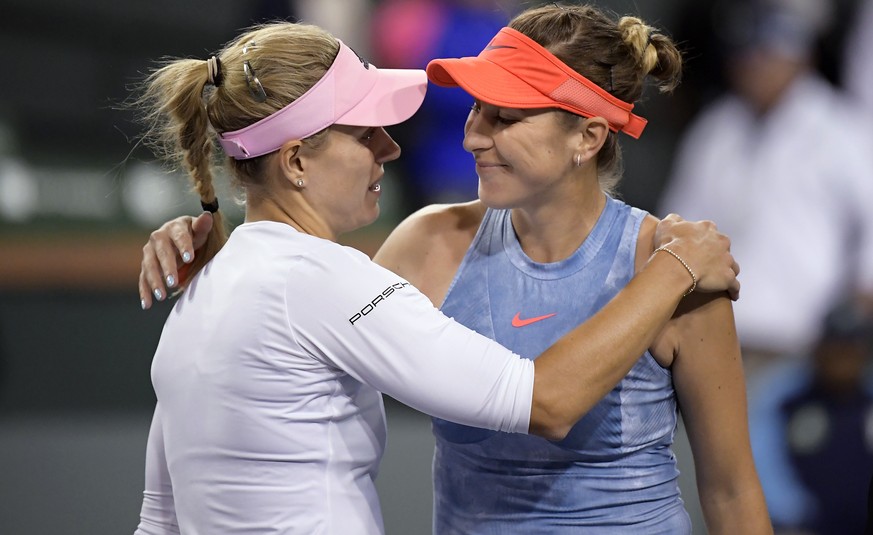 Angelique Kerber, left, of Germany, hugs Belinda Bencic, of Switzerland, after Kerber&#039;s win at the BNP Paribas Open tennis tournament Friday, March 15, 2019, in Indian Wells, Calif. Kerber won 6- ...