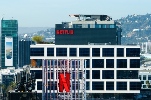 A Netflix sign and the company's logo are displayed atop buildings in Los Angeles, Thursday, Dec. 18, 2025. (AP Photo/Jae C. Hong)
Warner Bros