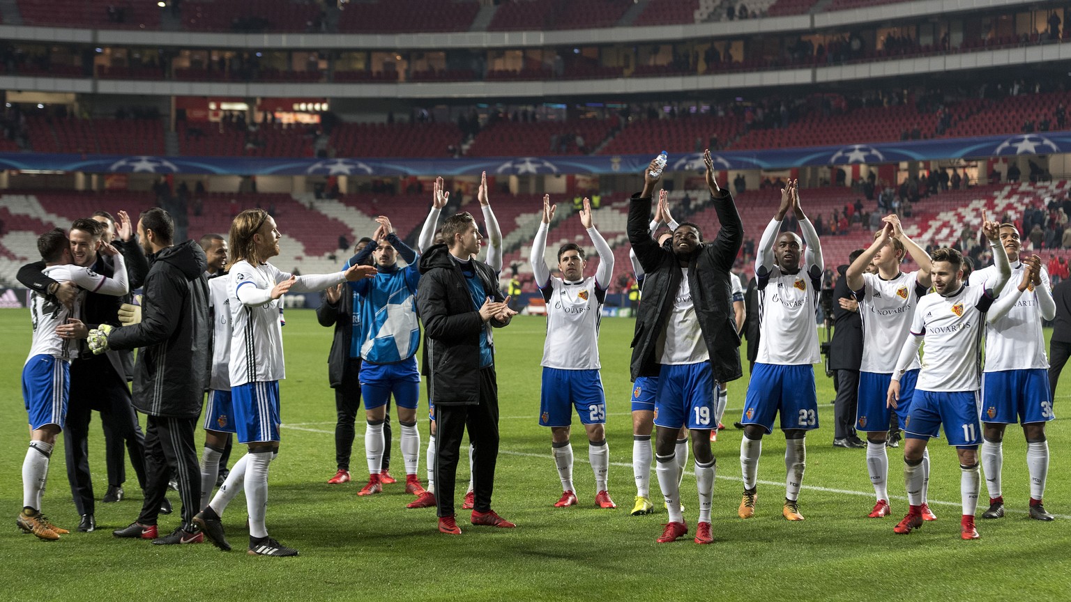 Basel&#039;s players cheer after winning the UEFA Champions League Group stage Group A matchday 6 soccer match between Portugal&#039;s SL Benfica and Switzerland&#039;s FC Basel 1893 in Benfica&#039;s ...