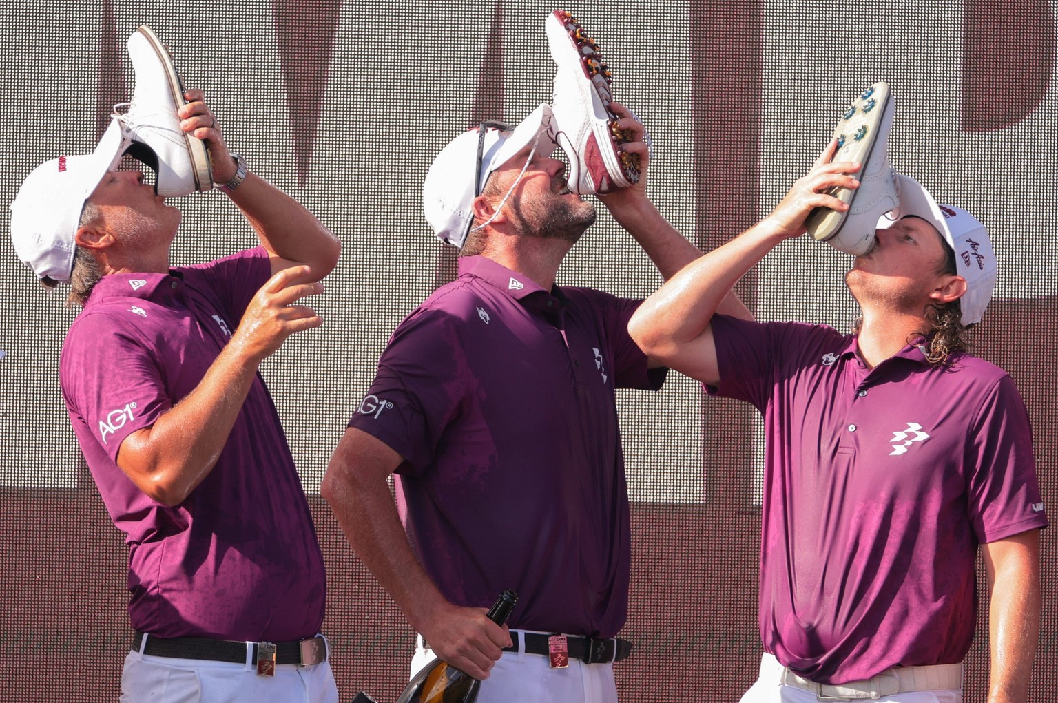 Golf: LIV Golf Miami - Final Round Apr 6, 2025 Miami, Florida, USA Matt Jones, Marc Leishman, and Cameron Smith drinks from a shoe after winning the final round of the LIV Golf Miami golf tournament a ...