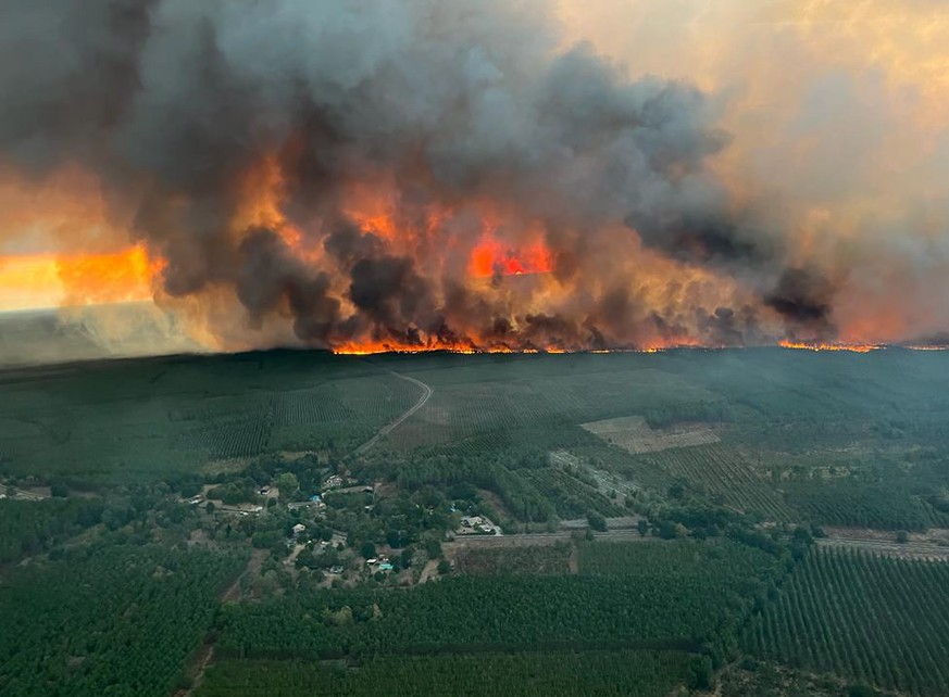 epa10113519 A handout photo made available by the communication department of the Gironde Firebrigade SDIS33 shows a forest fire in Saint Magne, in the Gironde region of southwestern France, 09 August ...