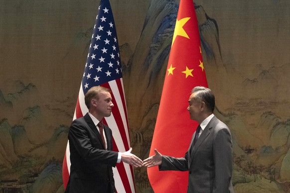 Wang Yi, right, the director of the Communist Party&#039;s Central Foreign Affairs Commission Office shakes hands with White House national security adviser Jake Sullivan, left, before their talk at Y ...