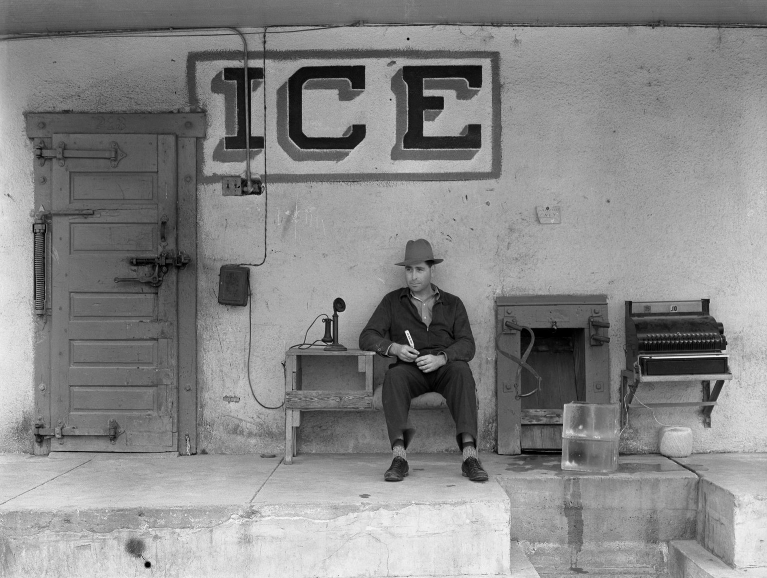 UNITED STATES - CIRCA 1915: A proprietor awaits the telephone call to deliver ice for a refrigerator or ice box (Photo by Buyenlarge/Getty Images)