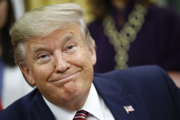 President Donald Trump participates in a bill signing ceremony for the Women&#039;s Suffrage Centennial Commemorative Coin Act in the Oval Office of the White House, Monday, Nov. 25, 2019, in Washingt ...