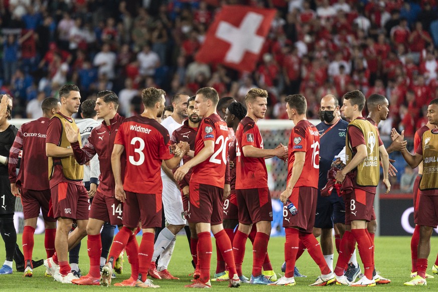 epa09450447 Switzerland players react at the end of the 2022 FIFA World Cup European Qualifying Group C soccer match between Switzerland and Italy in the St. Jakob-Park stadium in Basel, Switzerland,  ...