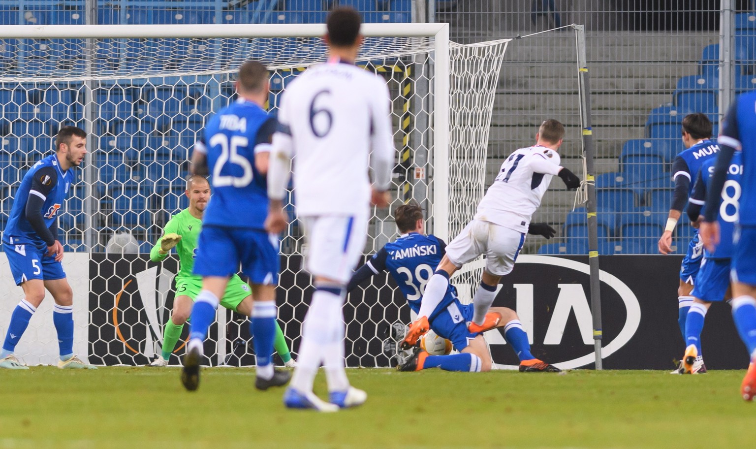 epa08875502 Cedric Itten (2R) of Glasgow Rangers in action during the UEFA Europa League Group D soccer match between Lech Poznan and Glasgow Rangers in Poznan, west-central Poland, 10 December 2020.  ...