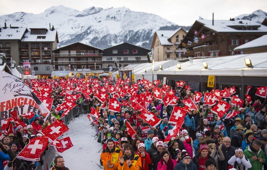 Fans celebrates during the prize giving ceremony after the men's downhill race of the FIS Alpine Ski World Cup season at the Lauberhorn, in Wengen, Switzerland, Sunday, January 18, 2015. (KEYSTON ...