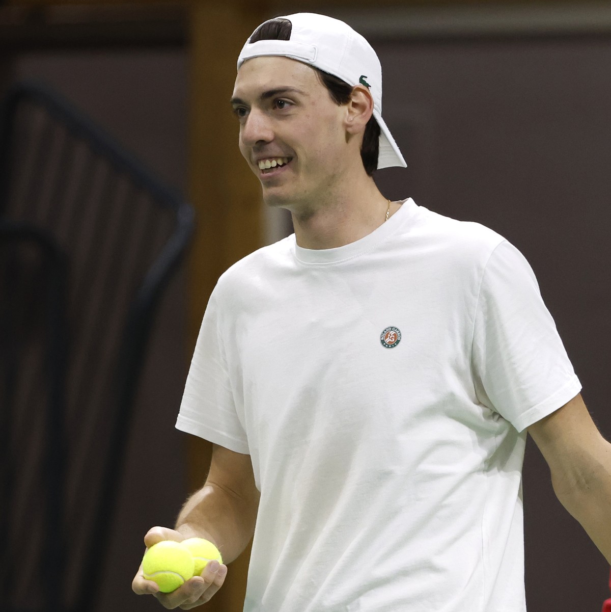 Switzerland's team captain Severin Luethi, back, and his player Marc-Andrea Huesler react during a training session in the Swiss Tennis Arena in Biel, Switzerland, Thursday, March 3, 2022. Switze ...