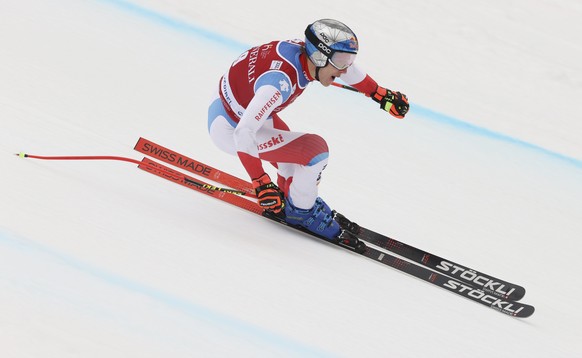 Switzerland&#039;s Marco Odermatt speeds down the course during an alpine ski, men&#039;s World Cup Finals downhill training, in Courchevel, France, Tuesday, March 15, 2022. (AP Photo/Alessandro Trova ...