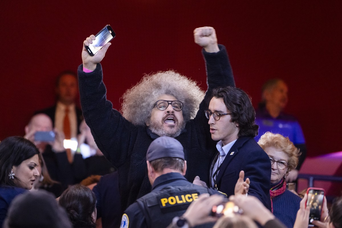 epa11099803 A pro-Palestinian protester interrupts US President Joe Biden (unseen) at a campaign rally for abortion rights at George Mason University in Manassas, Virginia, USA, 23 January 2024. The r ...