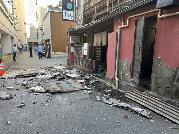 epa13136710 The exterior wall of a restaurant collapsed following the earthquake in Kumamoto City, southwestern Japan, 28 July 2026. According to the Japan Meteorological Agency, an earthquake of a ma ...