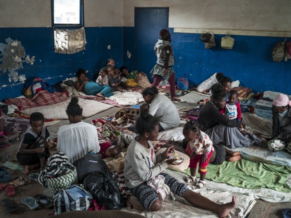 epa09730249 Some inhabitants of the neighborhood of Analamahitsy, whose houses were in danger of collapsing, are moved to a public elementary school as cyclone Batsirai is expected to hit Madagascar,  ...