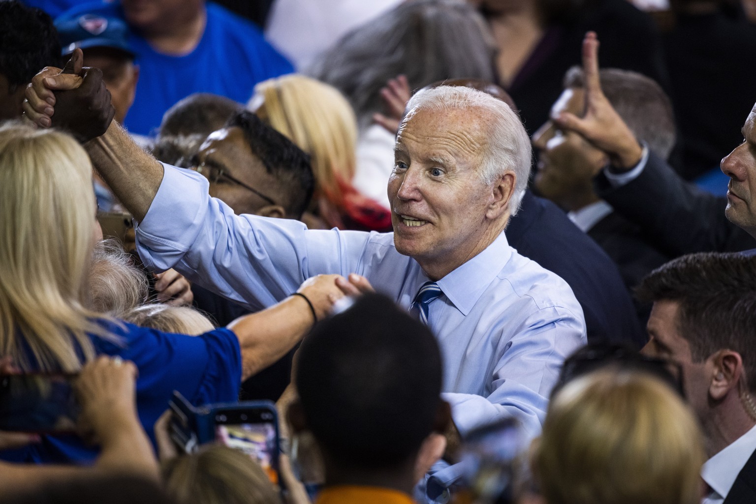 epa10139069 US President Joe Biden greets supporters after speaking at a rally for Maryland Democratic gubernatorial candidate Wes Moore at Richard Montgomery High School in Rockville, Maryland, USA,  ...