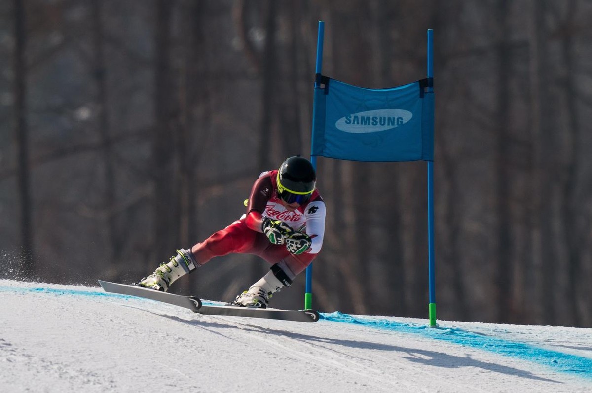 epa06592949 A handout photo made available by the Olympic Information Service of the International Olympic Committee shows Robin Cuche of Switzerland in action during the Alpine Skiing Standing Men  ...