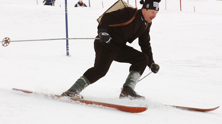 Michael Von Gruenigen of Switzerland speeds down the course wearing traditional dresses in Hafjell, Norway, Sunday, March 16, 2003. Von Gruenigen, announced Saturday he would retire from competition a ...