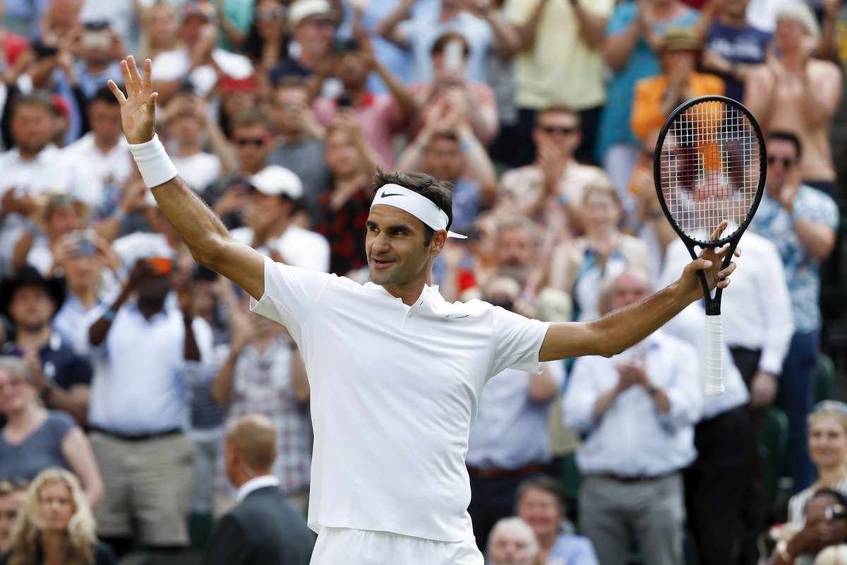 Roger Federer of Switzerland celebrates after beating Grigor Dimitrov of Bulgaria in their Men's Singles match, at the Wimbledon Championships at the All England Lawn Tennis Club, in London, Brit ...
