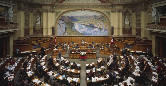 The lower house, the National Council, sits during the Federal Assembly&#039;s winter session in the National Council chamber of the Swiss Federal Parliament building in Berne, Switzerland, pictured o ...