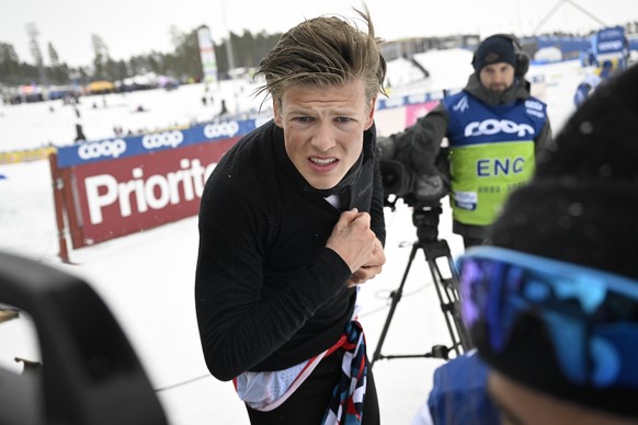 epa10528403 Johannes Hoesflot Klaebo of Norway reacts in the finish area during the Men's Interval Start 10.0 km Classic race of the FIS Cross Country Skiing World Cup in Falun, Sweden, 17 March ...