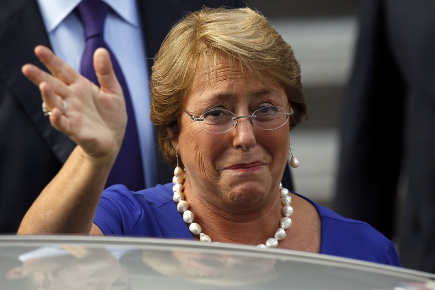 President-elect Michelle Bachelet, greets supporters after meeting with different authorities invited to the presidential inauguration, in Santiago, Chile, Monday, March 10, 2014. Bachelet will be swo ...