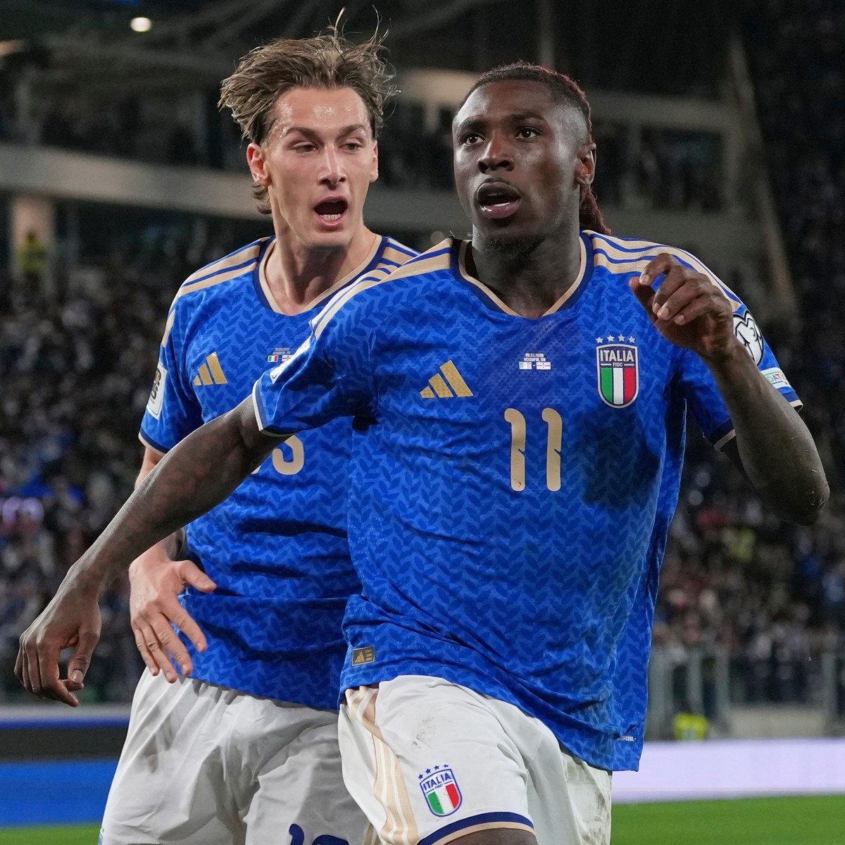 Italy's Francesco Pio Esposito, left, celebrates with Moise Kean who scored his side's second goal during the World Cup qualifying play-off soccer match between Italy and Northern Ireland, i ...