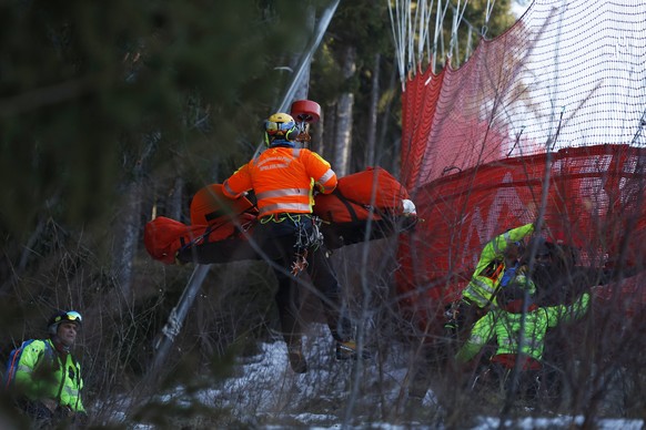Medical staff are carrying France&#039;s Cyprien Sarrazin after crashing into protections net during an alpine ski, men&#039;s World Cup downhill training, in Bormio, Italy, Friday, Dec. 27, 2024. (AP ...
